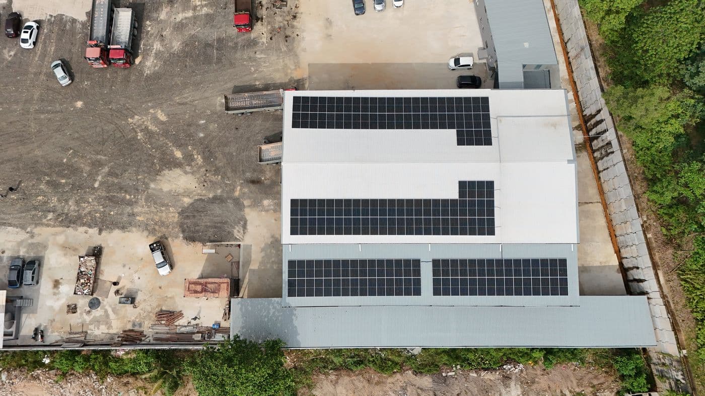 Aerial view of an off-grid site with solar panels on the building roof